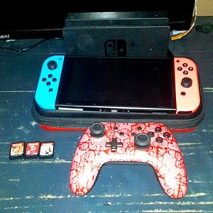 Nintendo switch with a Pro Controller and 3 games